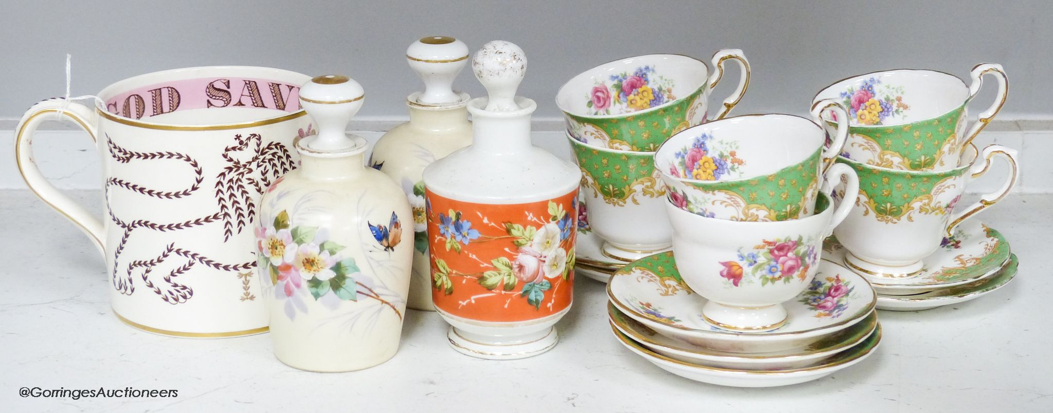 A Paragon tea set, three ceramic perfume bottles and stoppers and a Wedgwood commemorative mug